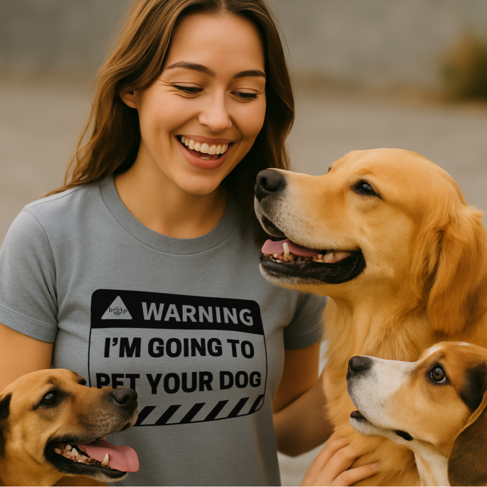 Woman wearing a t-shirt with a dog-themed message, standing with two dogs outdoors.