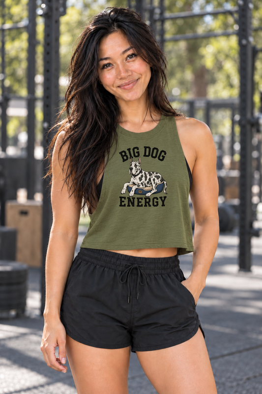 Grace wearing Boop Apparel Big Dog Energy Bella+Canvas 6682 crop tank in Heather Olive, front view at an outdoor gym.