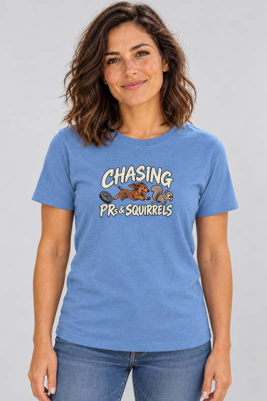 Amy wearing the Chasing PRs and Squirrels Everyday T in Heather Columbia Blue, front studio view.