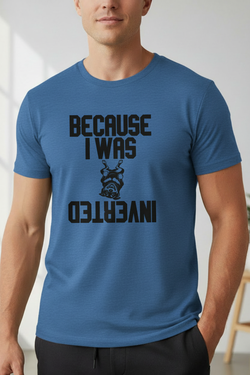 Athletic male model wearing a heather true royal crew neck t-shirt featuring the Because I Was Inverted rottweiler graphic — Top Gun parody shirt for dog lovers, CrossFit athletes, and handstand enthusiasts. Part of the Boop Apparel Everyday T workout collection.
