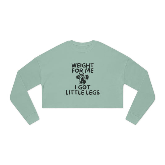 Women's cropped sweatshirt in green with "Weight for Me I Got Little Legs" text and corgi doing a back squat graphic