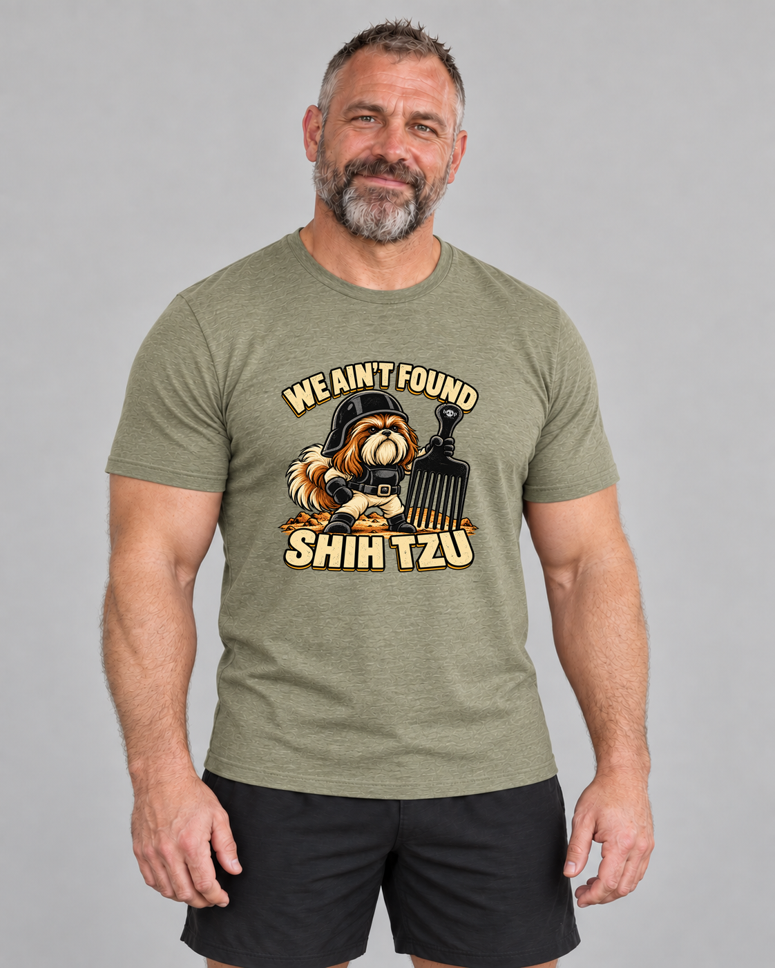 Ed wearing We Ain't Found Shih Tzu 2.0 Everyday T in Heather Olive