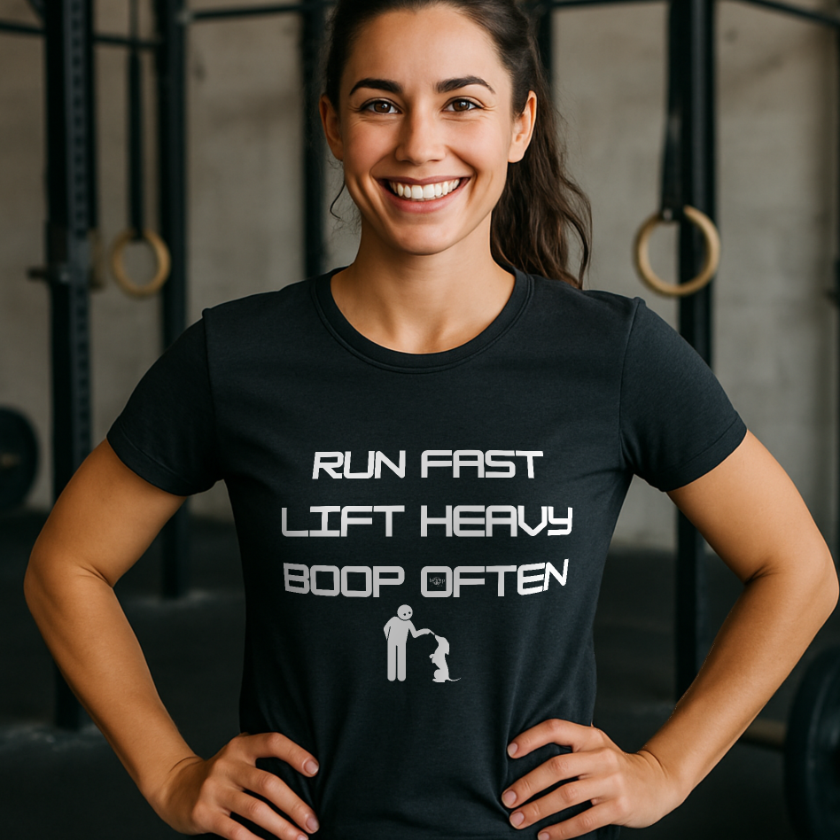 Woman wearing a black t-shirt with a humorous fitness message in a gym setting