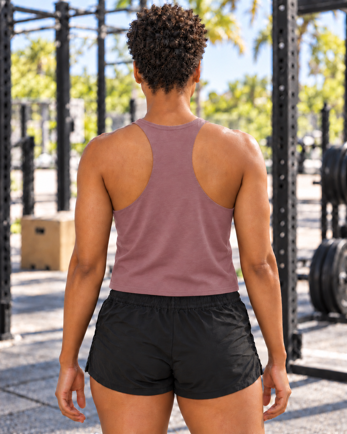 Brandy wearing the 0% Chill Heather Mauve Bella+Canvas 6682 crop tank, back view
