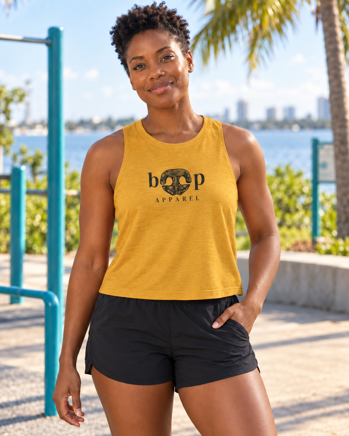 Brandy wearing Boop Apparel Logo crop tank in Heather Mustard, front view
