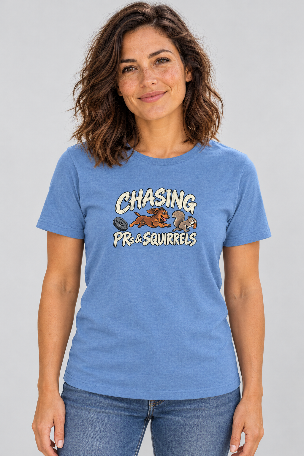 Amy wearing the Chasing PRs and Squirrels Everyday T in Heather Columbia Blue, front studio view.