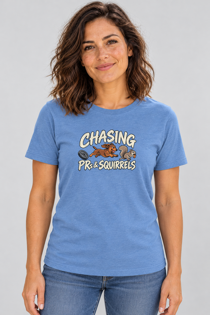 Amy wearing the Chasing PRs and Squirrels Everyday T in Heather Columbia Blue, front studio view.