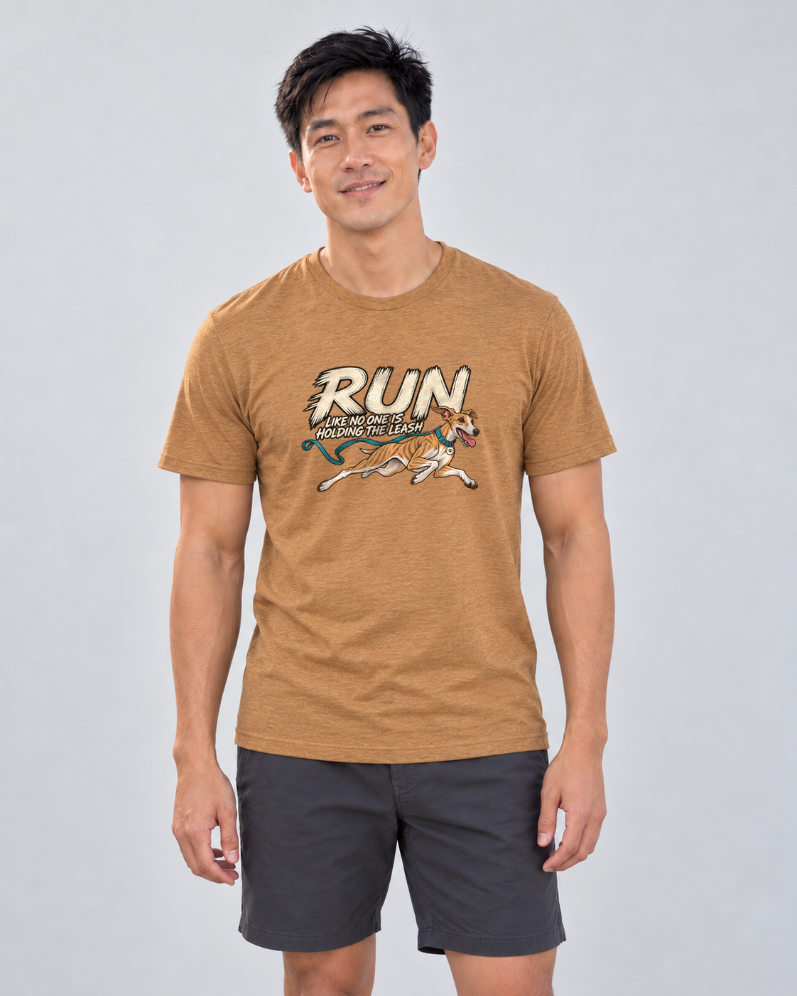 Finn wearing Run Unleashed Everyday T in Heather Autumn, studio photograph